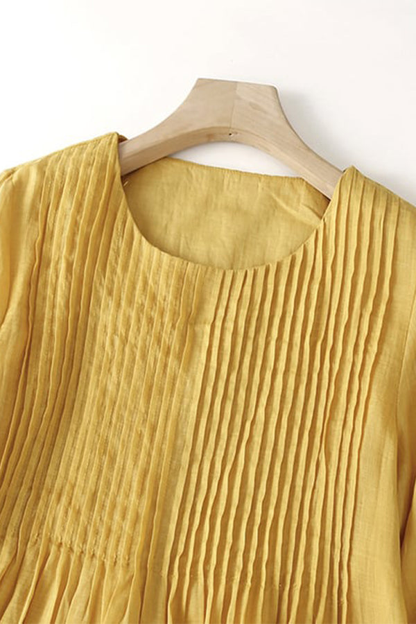 Robe ample plissée de couleur unie