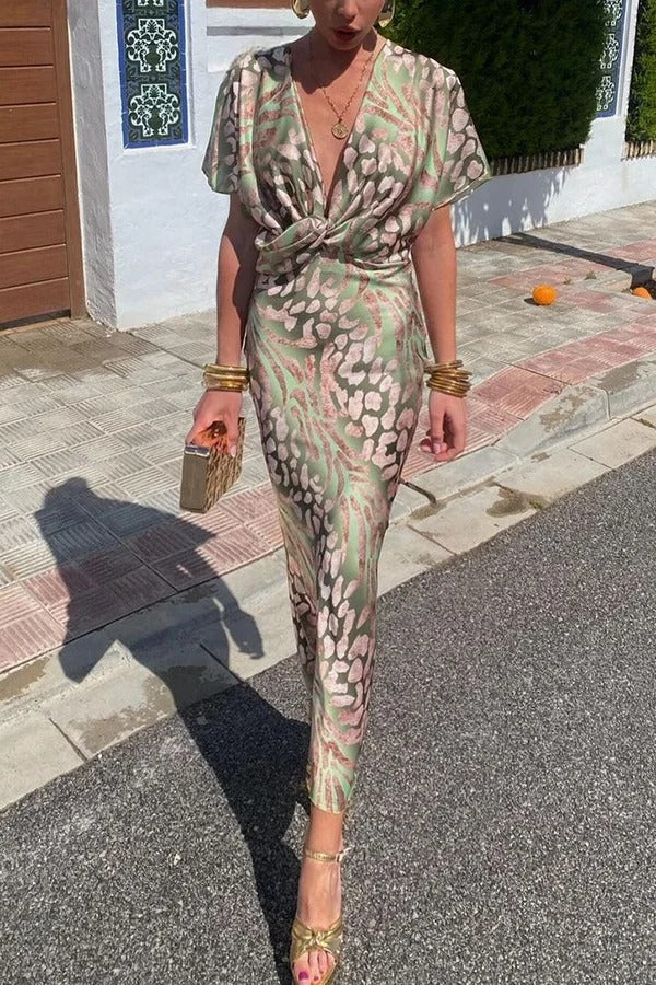 Einzigartiges bedrucktes, kurzärmliges Maxikleid mit V-Ausschnitt und Knotendetail in schmaler Passform