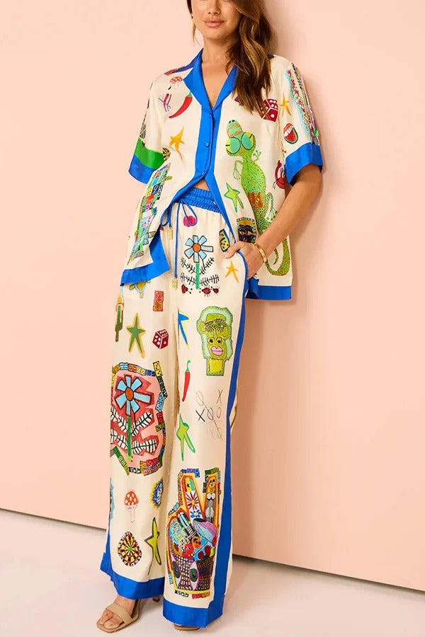 Lebendige Strandsatinhose mit einzigartigem Druck, Farbblockbesatz, elastischer Taille und weiten Beinen